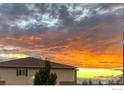 House exterior showcasing an incredible sunset at 10818 Cimarron St # 1203, Firestone, CO 80504