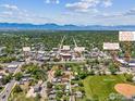 Aerial view showing the home's location near downtown Louisville, Miner's Park, and the Rocky Mountains at 1101 Spruce St, Louisville, CO 80027
