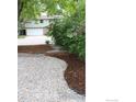 Curb appeal of a home showcasing meticulous landscaping and fresh mulch at 1714 Zeus Dr, Lafayette, CO 80026