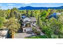 Stunning home exterior with modern design, lush landscaping, and mountain views at 1801 Redwood Ave, Boulder, CO 80304