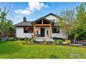 Charming home featuring a well-manicured lawn and a welcoming front porch at 1801 Redwood Ave, Boulder, CO 80304