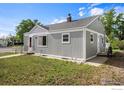 Charming single-story home with a well-maintained lawn and inviting front entrance at 201 4Th St, Frederick, CO 80530