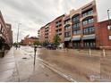 Brick building facade with awnings and balconies on a cloudy day at 2245 Blake St # D, Denver, CO 80205