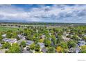 Beautiful aerial view of a home with mature trees and open space in the background at 2563 Otter Ct, Lafayette, CO 80026