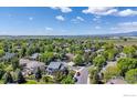 Scenic aerial view of a home nestled amongst lush greenery in a quiet neighborhood at 2563 Otter Ct, Lafayette, CO 80026