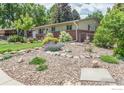 Lovely home featuring a xeriscaped front yard with a variety of rocks and plants at 501 Copeland Way, Longmont, CO 80504