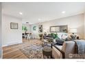 Inviting living room with a comfortable seating area, stylish decor, and wood-look floors at 518 Sunset Dr, Louisville, CO 80027