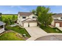Two-story home with a three-car garage, well-maintained lawn, and a long driveway leading to the street at 682 Briar Dale Dr, Castle Pines, CO 80108