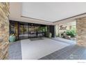 Elegant building lobby featuring stone accents, tiled floors, and lush greenery at 800 N Washington St # 409, Denver, CO 80203