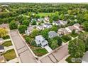 An aerial view showcases the neighborhood and surrounding green spaces at 823 Timothy Dr, Longmont, CO 80503