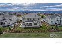 Backyard featuring a lush lawn, a covered patio, and privacy fencing at 913 Green Mountain Dr, Erie, CO 80516