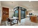 Bright and airy living space, with wood floors, large windows and an open layout to the kitchen at 1077 Canyon Blvd # 211, Boulder, CO 80302