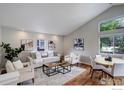 Bright living room with modern furnishings, hardwood floors, and large windows at 109 Gold Hill Dr, Lafayette, CO 80026