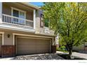 Close up of townhome's exterior featuring a private garage at 13024 Grant W Cir # A, Thornton, CO 80241