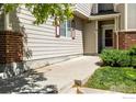 Side view of a well-maintained townhome with a welcoming entrance at 13024 Grant W Cir # A, Thornton, CO 80241