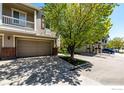 Close up of townhome's exterior featuring address and private garage at 13024 Grant W Cir # A, Thornton, CO 80241