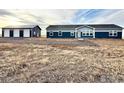 Manufactured home with large metal workshop situated on a large lot at 17913 County Road 38, Platteville, CO 80651