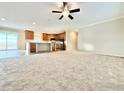 Bright living room flows to open kitchen with updated cabinets, countertops and appliances at 17913 County Road 38, Platteville, CO 80651