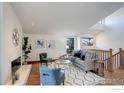 Bright living room with hardwood floors, fireplace, and comfortable seating at 1880 Kohler Dr, Boulder, CO 80305