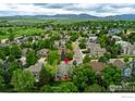Aerial view showcasing the home in a neighborhood with mountain views at 2204 Lasalle St, Superior, CO 80027