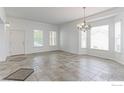 Spacious dining area with tile flooring and bright windows that fills the room with light at 2631 E 136Th Pl, Thornton, CO 80602