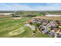 Wide aerial view showcasing neighborhood, nearby Foster and Sanborn Reservoirs, and green spaces at 2767 Stallion Way, Mead, CO 80542