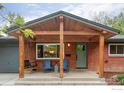 Inviting front porch with comfortable seating and stylish design at 3445 Martin Dr, Boulder, CO 80305