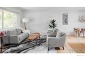 Spacious living room with modern decor, hardwood flooring, and ample natural light at 3445 Martin Dr, Boulder, CO 80305