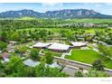Stunning aerial view of a neighborhood featuring modern architecture with flatirons in the background at 50 S 31St St, Boulder, CO 80305