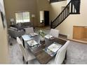 Bright dining area with seating for six, complemented by neutral tones and natural light at 804 Nelson Park Ln, Longmont, CO 80503