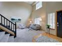 Bright living room featuring high ceilings and neutral decor at 804 Nelson Park Ln, Longmont, CO 80503