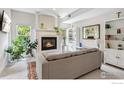 Bright living room featuring a fireplace, large windows, and built-in bookshelves, creating a cozy atmosphere at 820 Kimbark St # D, Longmont, CO 80501