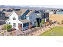 This property offers a great view of its surroundings, featuring a wooden fence and solar panels at 8353 Bijou Creek Ave, Littleton, CO 80125