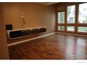 Living room features hardwood floors, a contemporary shelf, and lots of natural light at 10350 Tumbleweed Dr # 32, Thornton, CO 80229