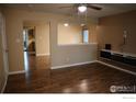 Bright living room with hardwood floors, and a unique shelf at 10350 Tumbleweed Dr # 32, Thornton, CO 80229