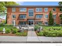 Beautiful red brick apartment building with a well-manicured lawn at 1201 Balsam Ave # 201, Boulder, CO 80304