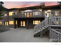 The backyard has multi-level decks and stairs perfect for outdoor entertaining and relaxation at 142 Meadowlook Way, Boulder, CO 80304