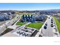 Westerly community clubhouse with manicured lawn and outdoor seating at 165 Washington St, Erie, CO 80516