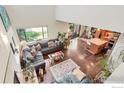 Open-concept living area with hardwood floors, modern decor, large windows, and seamless flow to the kitchen at 2617 Juniper Ave, Boulder, CO 80304