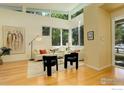 Bright living room with floor-to-ceiling windows, hardwood floors, and contemporary furnishings and decor at 2750 7Th St, Boulder, CO 80304