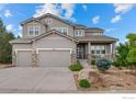 Charming two-story home with a three-car garage and landscaped front yard at 3075 Blue Mountain Dr, Broomfield, CO 80023