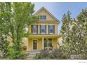 Charming two-story home with a welcoming front porch and well-maintained landscaping at 634 Homestead St, Lafayette, CO 80026