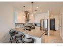 Modern kitchen featuring stainless steel appliances, sleek countertops, and stylish bar seating at 1616 S Broadway # 304, Denver, CO 80210