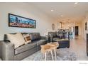 Cozy living room with comfortable seating, modern decor, and an open view to the kitchen at 1616 S Broadway # 304, Denver, CO 80210