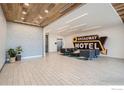 Spacious lobby area with modern design, stylish seating, and unique 'Broadway Motel' sign at 1616 S Broadway # 304, Denver, CO 80210