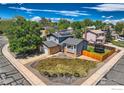 An aerial view of a two-story home featuring solar panels and fenced yard at 2447 E 100Th Way, Thornton, CO 80229