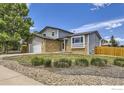 Two-story home with lovely rock landscaping and a spacious front yard at 2447 E 100Th Way, Thornton, CO 80229