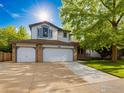 Charming two-story home with three-car garage and well-maintained lawn in a suburban neighborhood at 2720 E 121St Pl, Thornton, CO 80241