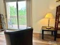 Comfortable living room area with chair and sliding door to a deck at 2855 Shadow Creek Dr # 302, Boulder, CO 80303