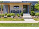 Charming front porch with rocking chairs, stylish planters, and a well-manicured lawn at 3681 Paonia St, Boulder, CO 80301